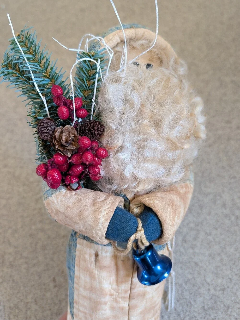FOLK ART SANTA CLAUS wearing an antique quilt